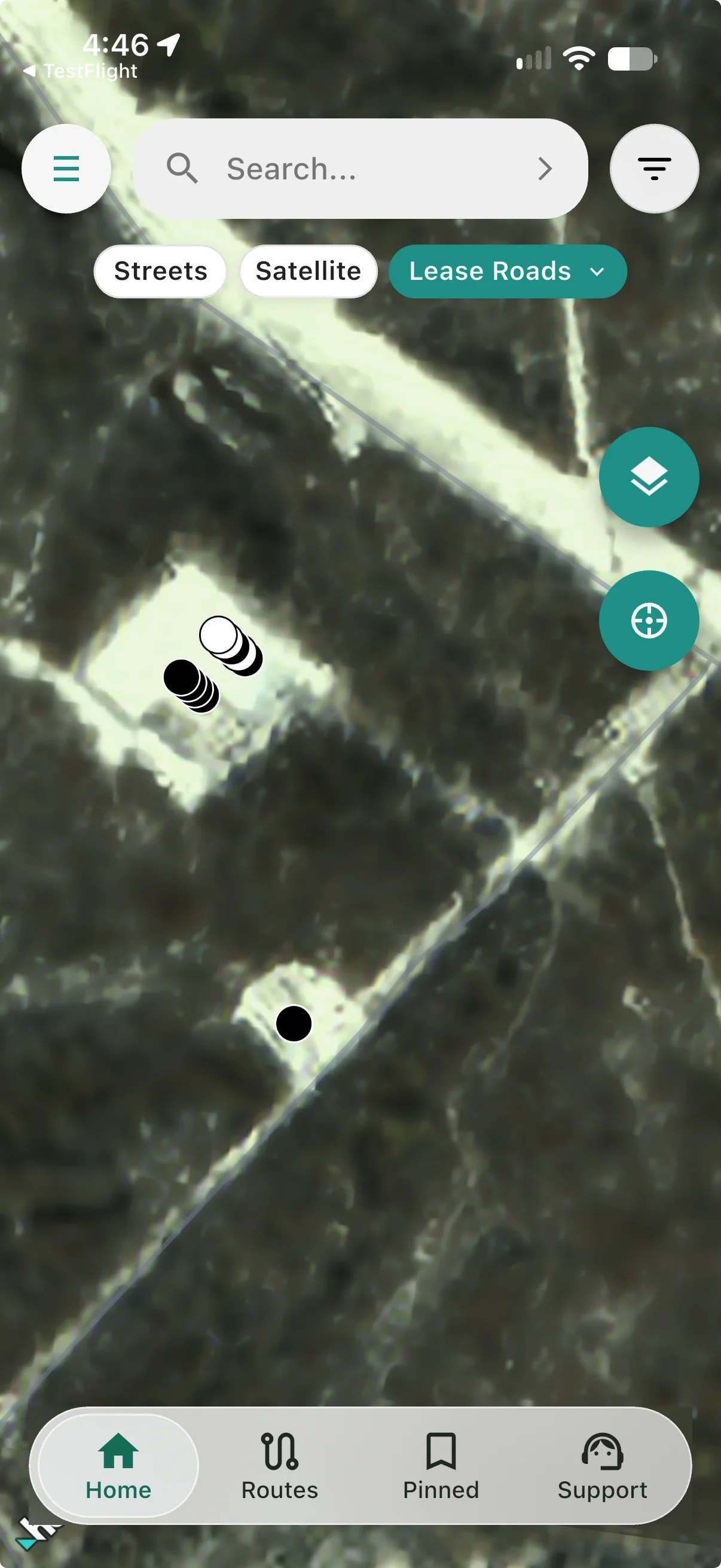 Lease Roads selected with snow-covered pads and access roads visible beneath the well markers